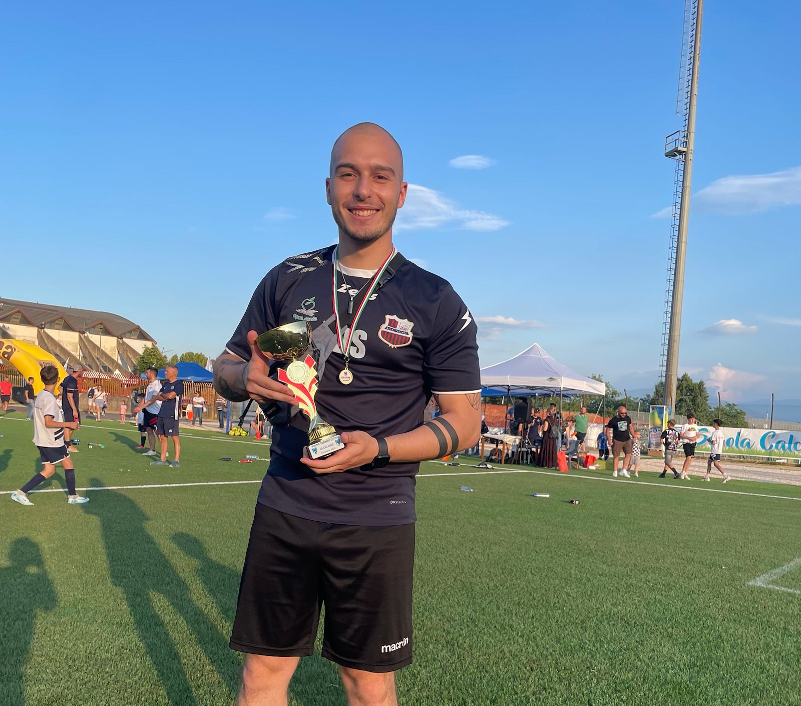 Emanuele De Sanctis with trophy and medals